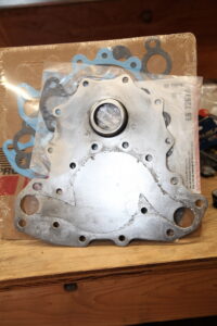 6.2L Detroit Diesel water pump backing plate showing advanced pitting.